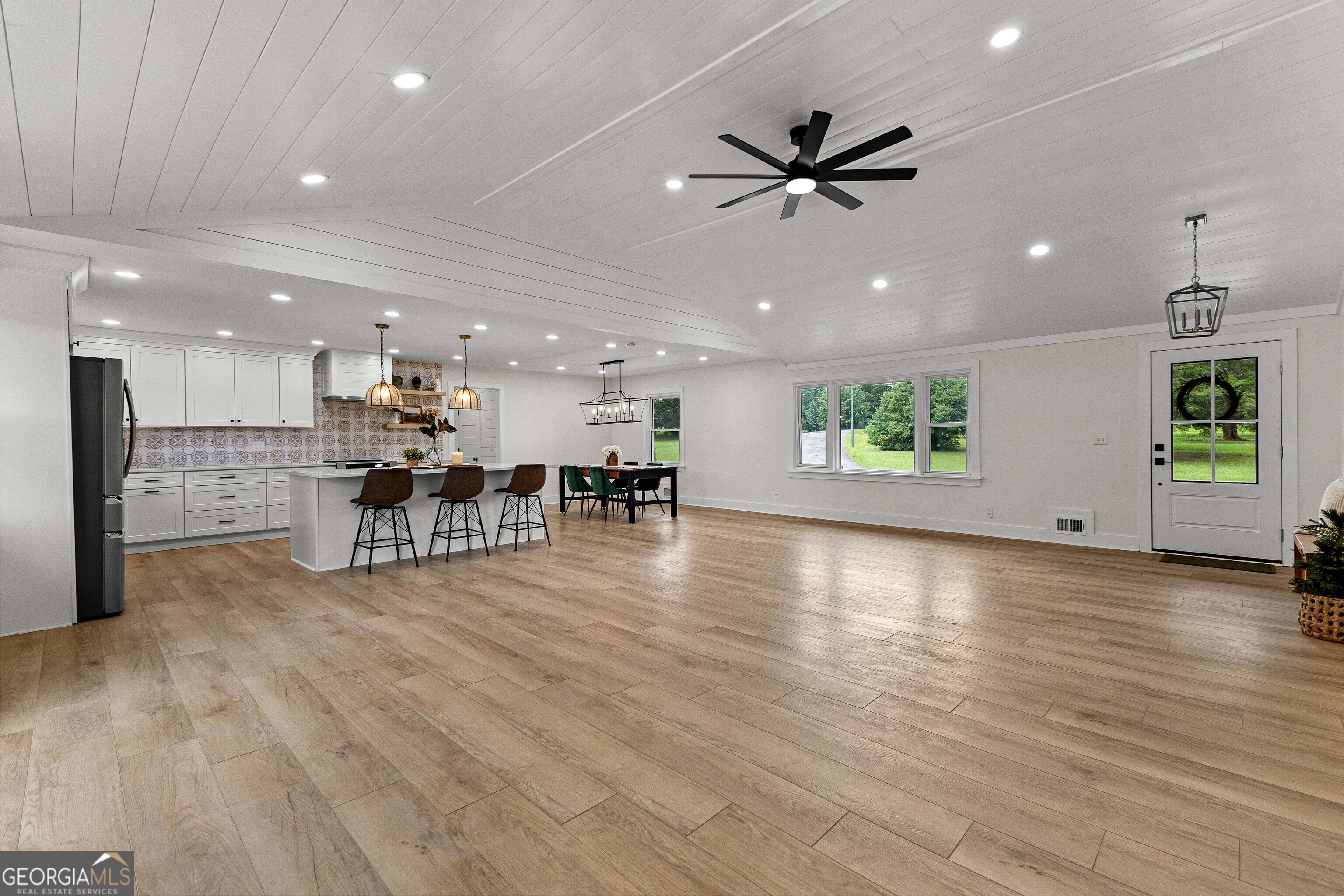 1367 Sharpsburg McCollum Road Sharpsburg, GA 30277 - Photo 23 of 80 a view of a kitchen with a sink and a stove top oven with wooden floor