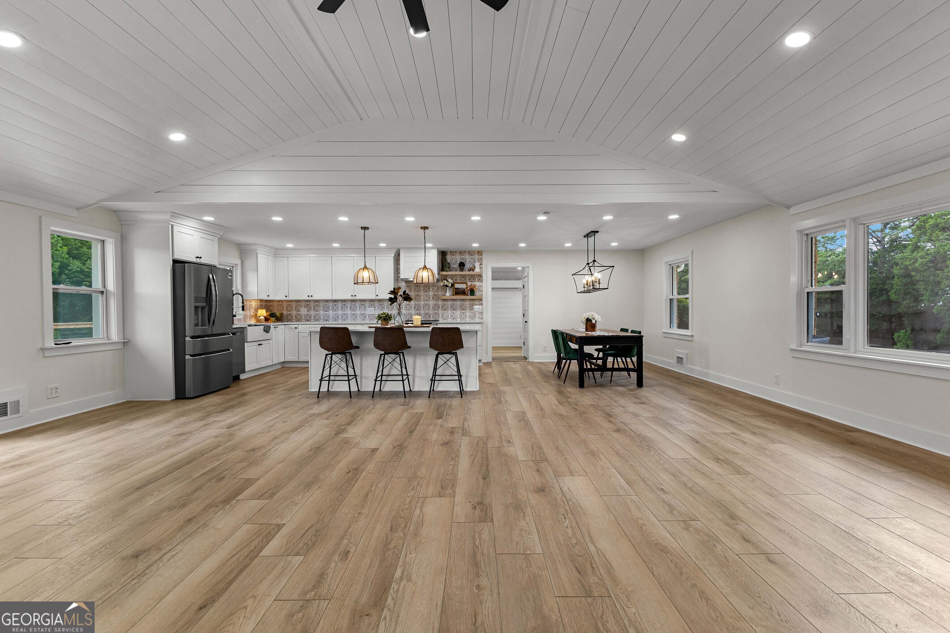 1367 Sharpsburg McCollum Road Sharpsburg, GA 30277 - Photo 24 of 80 a view of a kitchen with a table and chairs wooden floor kitchen view and a window