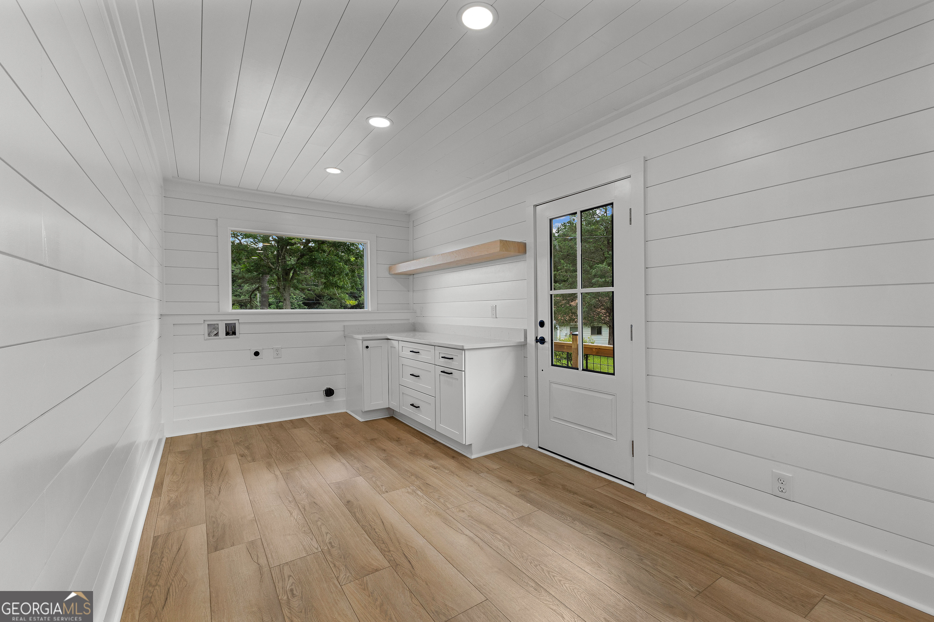1367 Sharpsburg McCollum Road Sharpsburg, GA 30277 - Photo 29 of 80 an empty room with wooden floor and windows