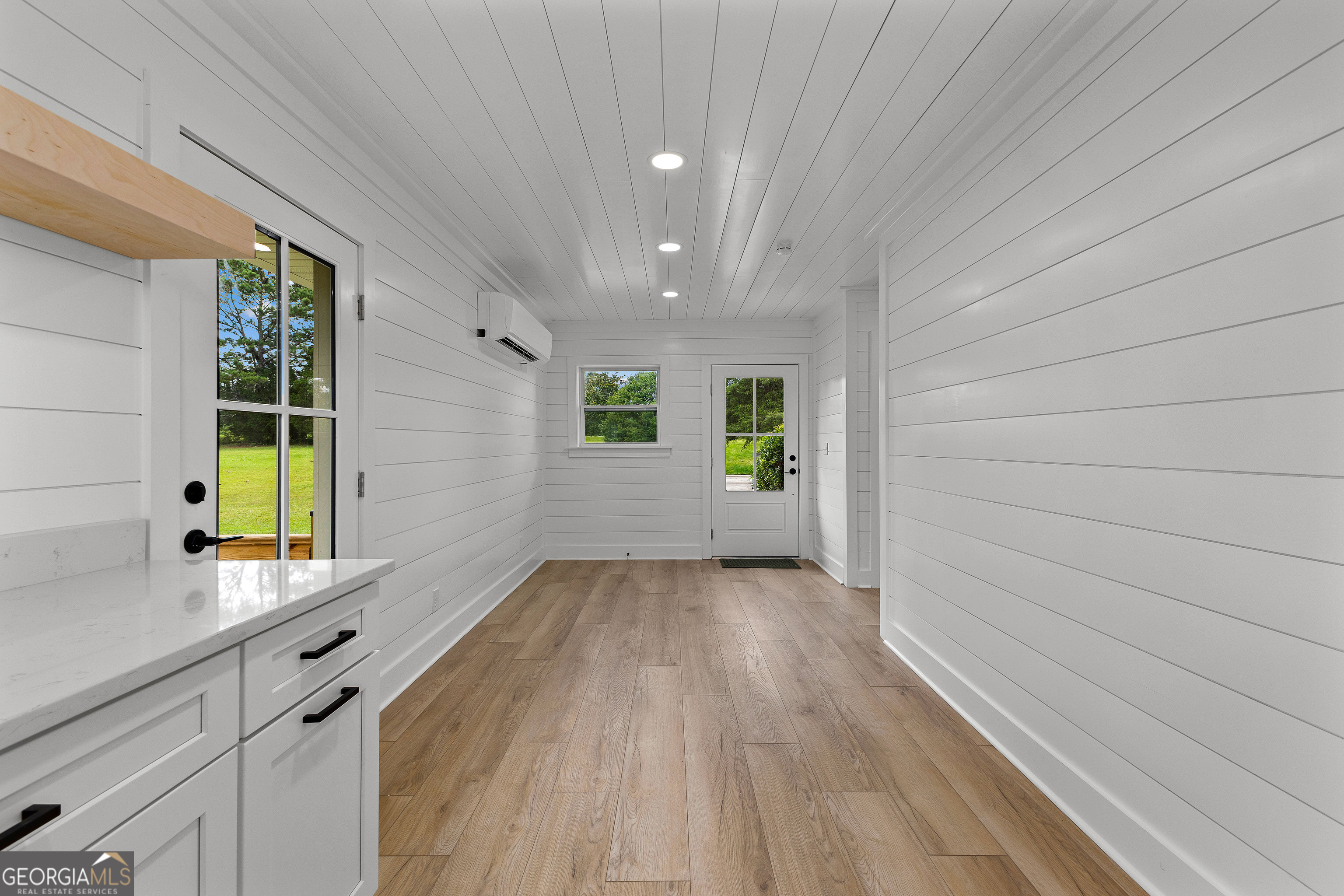 1367 Sharpsburg McCollum Road Sharpsburg, GA 30277 - Photo 31 of 80 a view of an empty room with a window and wooden floor
