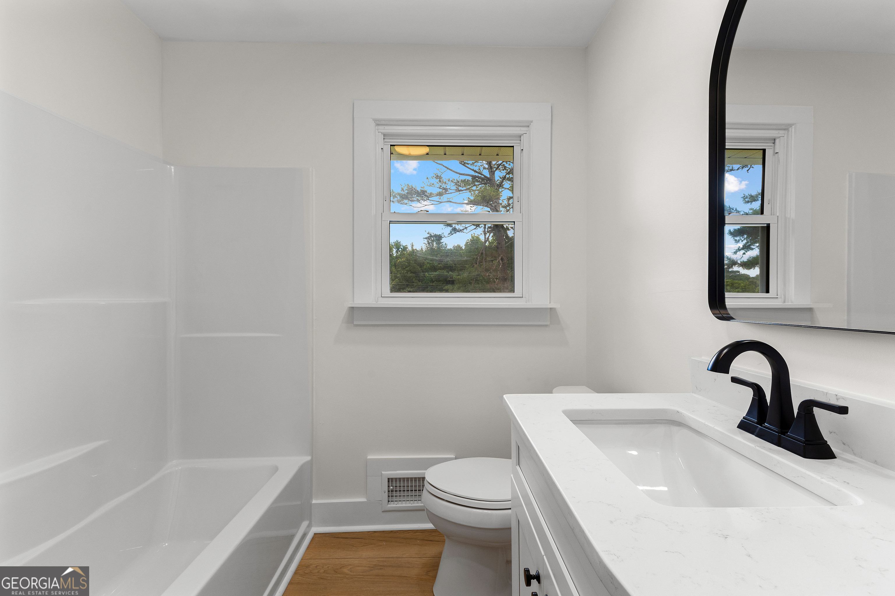 1367 Sharpsburg McCollum Road Sharpsburg, GA 30277 - Photo 36 of 80 a bathroom with a sink toilet and bathtub