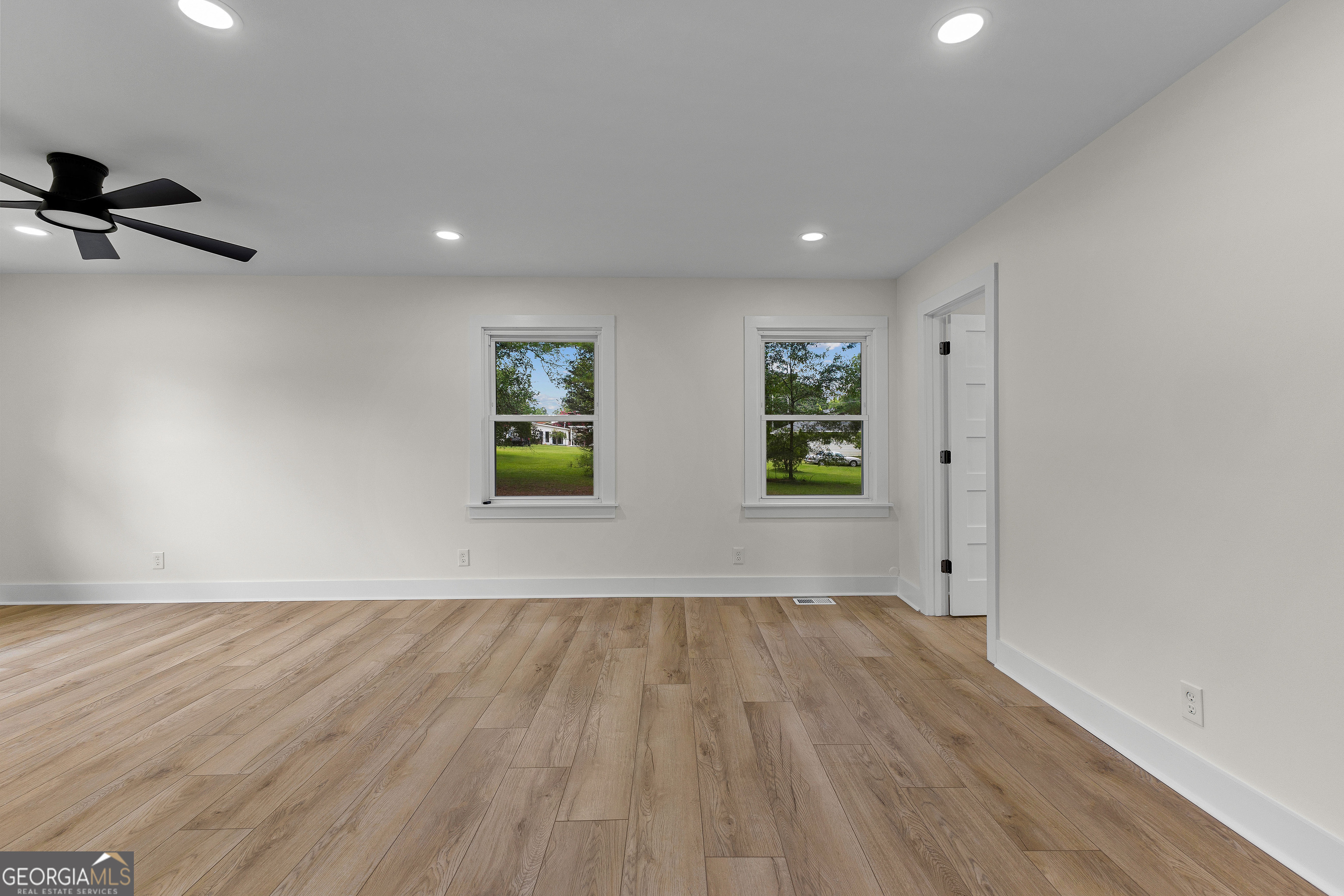 1367 Sharpsburg McCollum Road Sharpsburg, GA 30277 - Photo 43 of 80 wooden floor in an empty room with a window