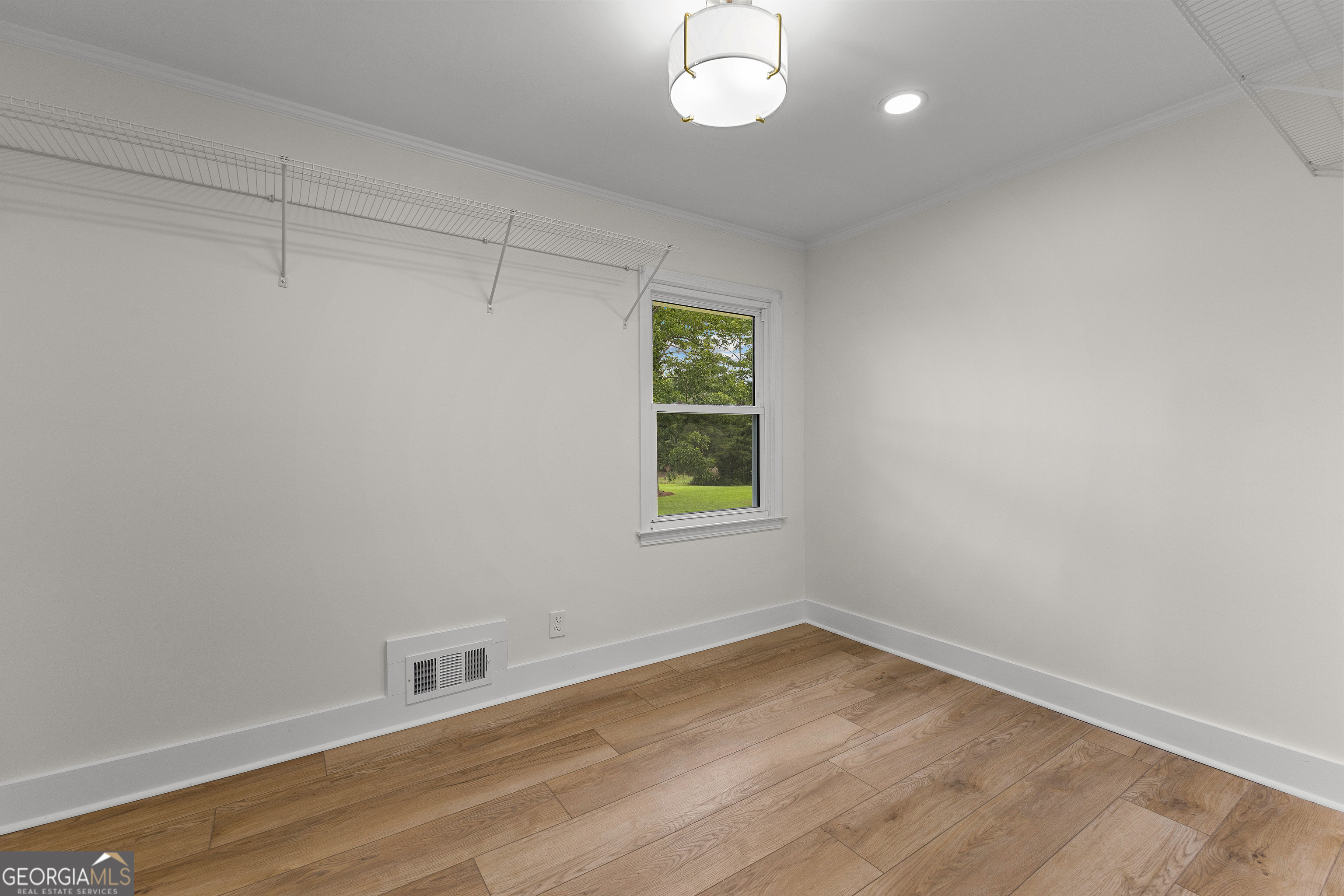 1367 Sharpsburg McCollum Road Sharpsburg, GA 30277 - Photo 51 of 80 wooden floor in an empty room with a window