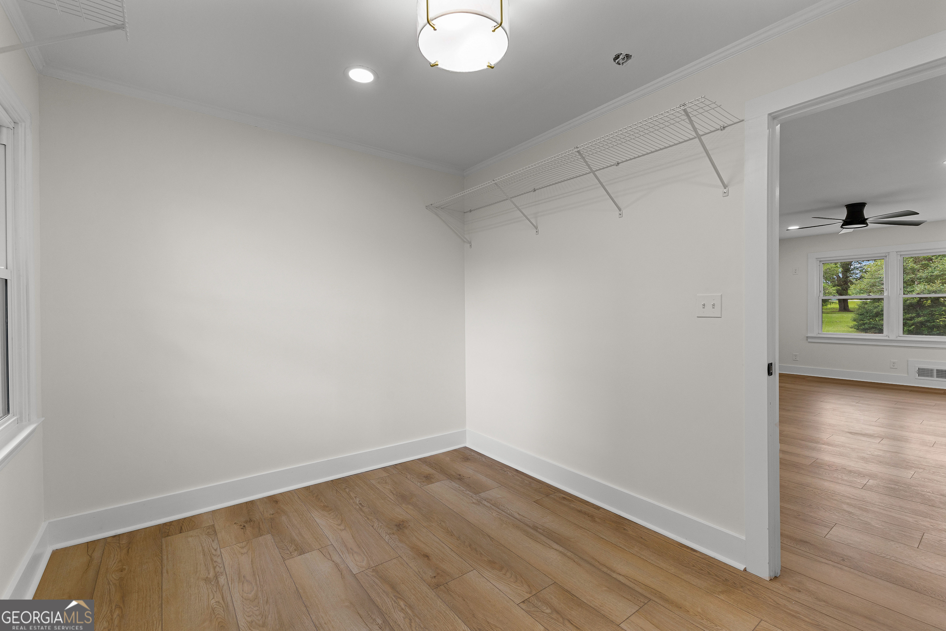 1367 Sharpsburg McCollum Road Sharpsburg, GA 30277 - Photo 52 of 80 a view of empty room with wooden floor and fan