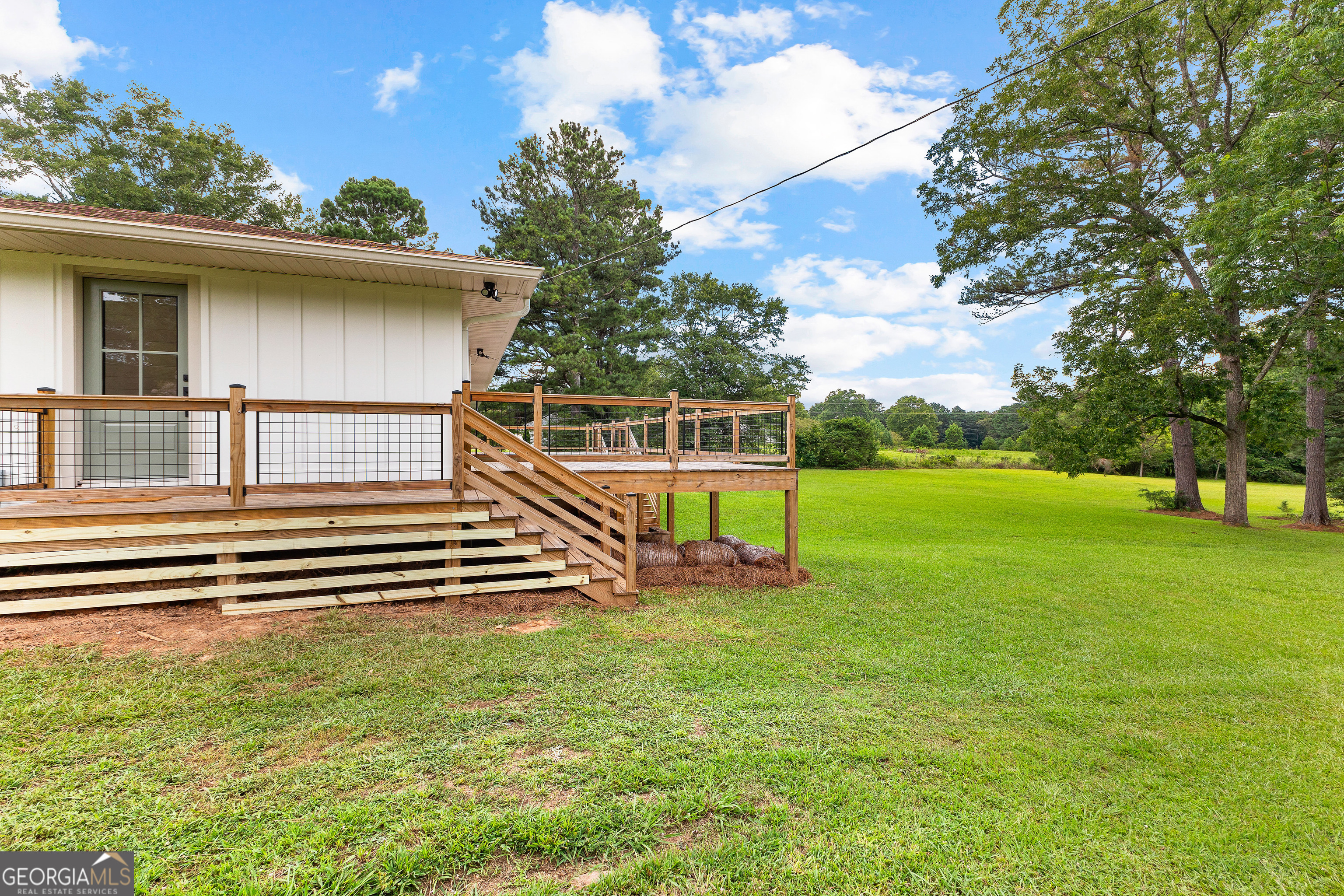 1367 Sharpsburg McCollum Road Sharpsburg, GA 30277 - Photo 60 of 80 a view of a backyard with a garden