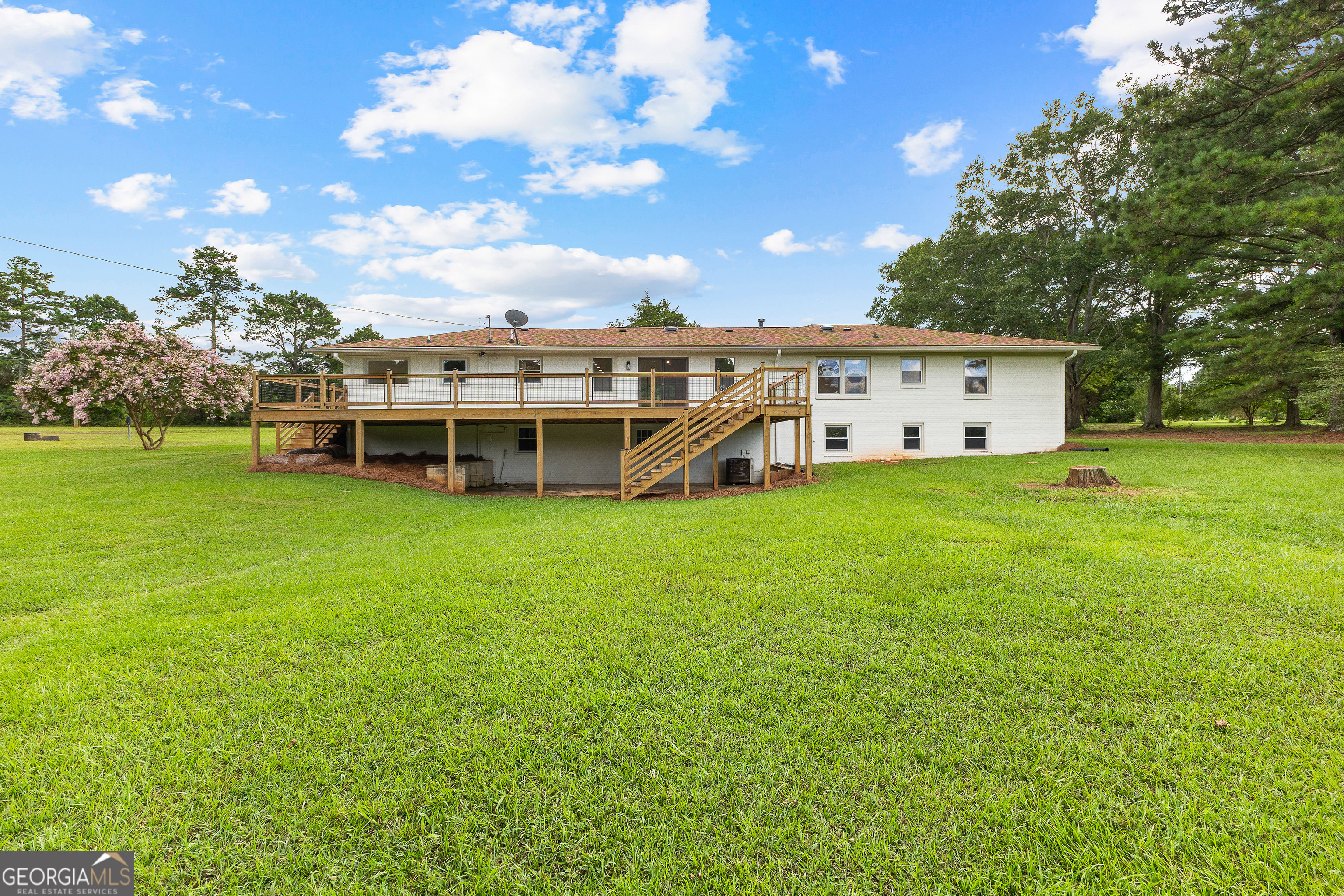 1367 Sharpsburg McCollum Road Sharpsburg, GA 30277 - Photo 62 of 80 a view of a house with a big yard and large trees