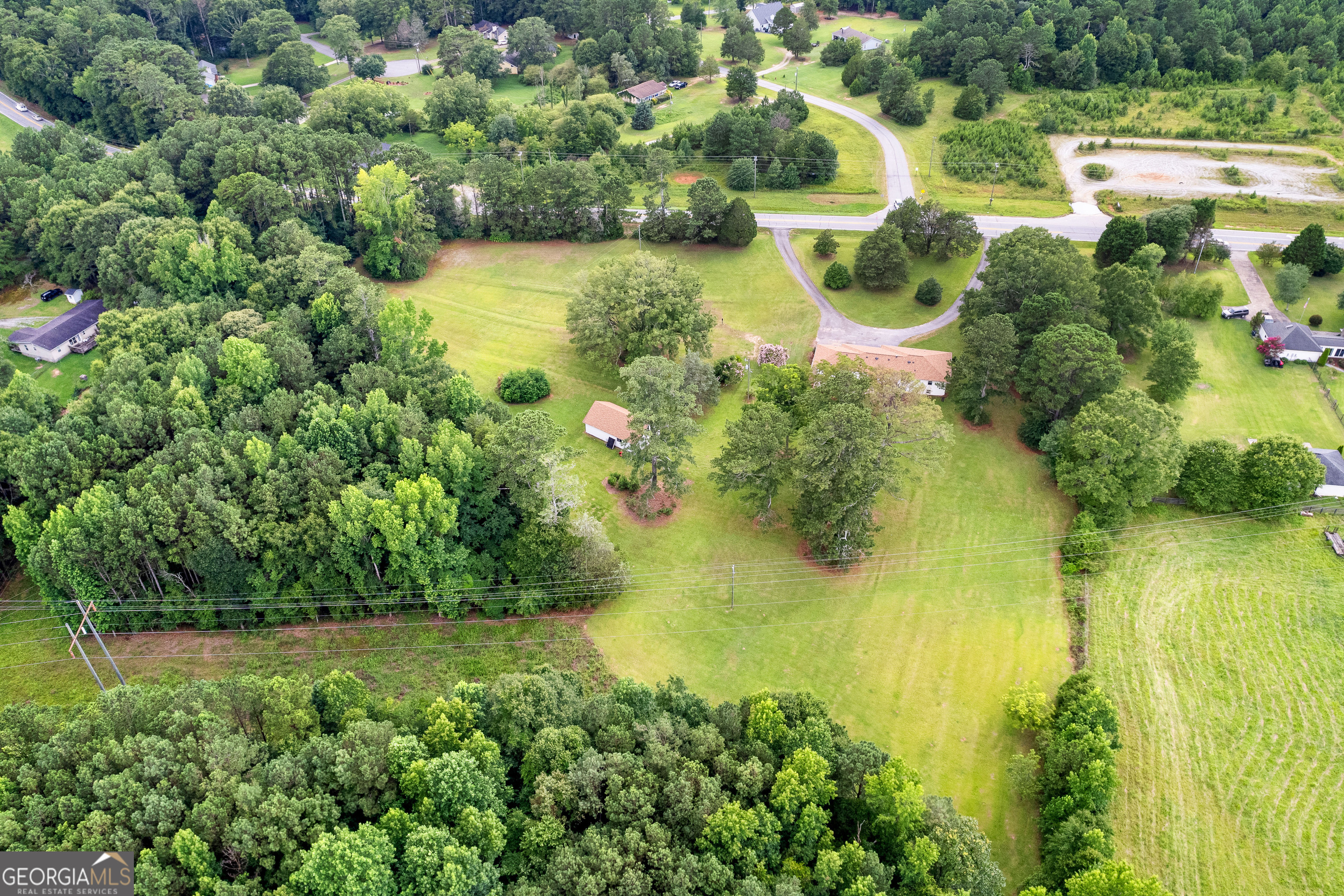 1367 Sharpsburg McCollum Road Sharpsburg, GA 30277 - Photo 64 of 80 a view of a lake with houses