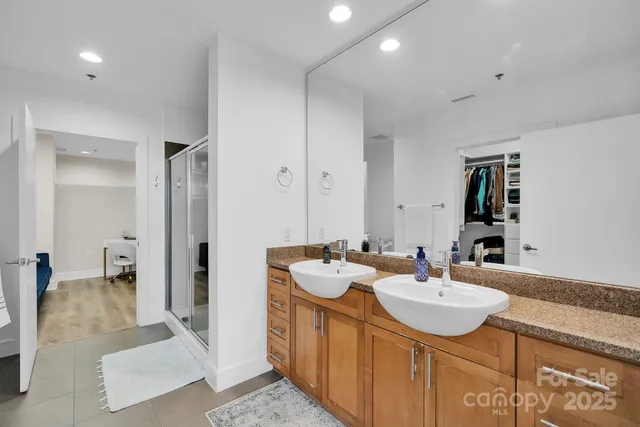 a bathroom with a sink double vanity and a mirror