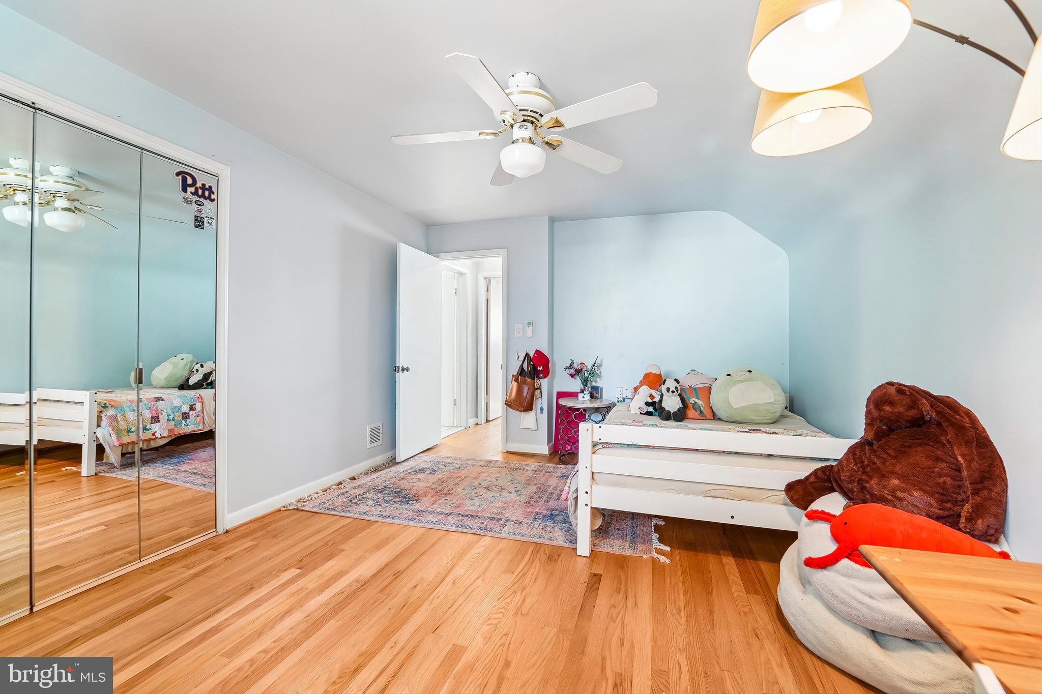 6640 Loch Hill Road Baltimore, MD 21239 - Photo 18 of 35 a living room with furniture and a wooden floor