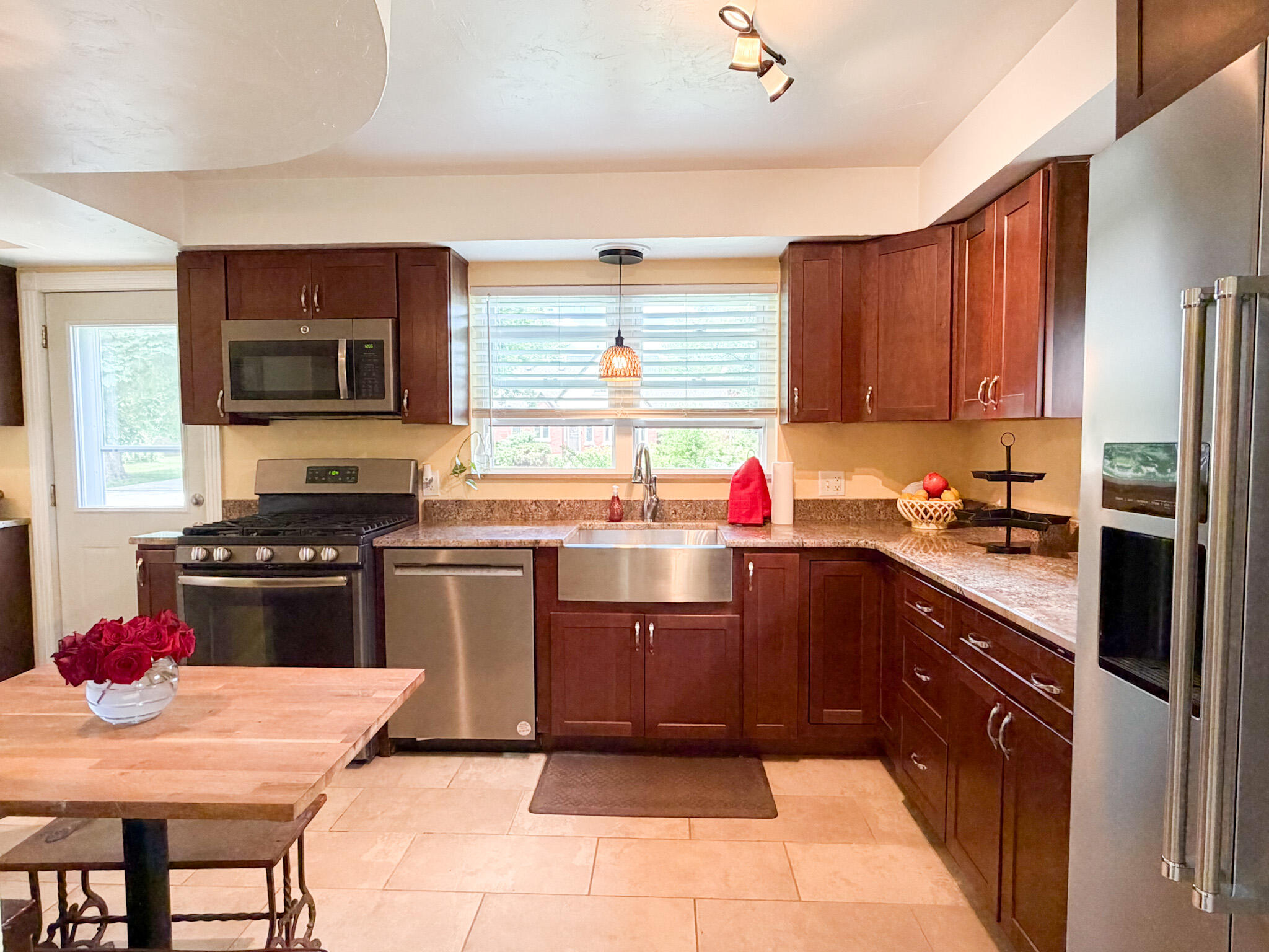 108 Beverly Place Munster, IN 46321 - Photo 5 of 47 a kitchen with a stove a sink and a refrigerator