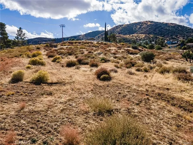 a view of a lake with mountains in the background
