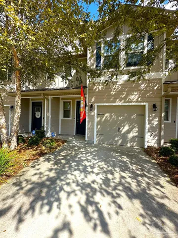 a view of a house with a tree