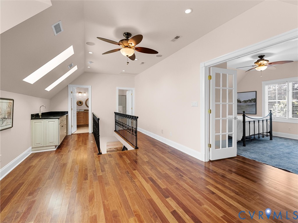 13612 Waterswatch Court Midlothian, VA 23113 - Photo 69 of 88 a view of a room with wooden floor and a ceiling fan
