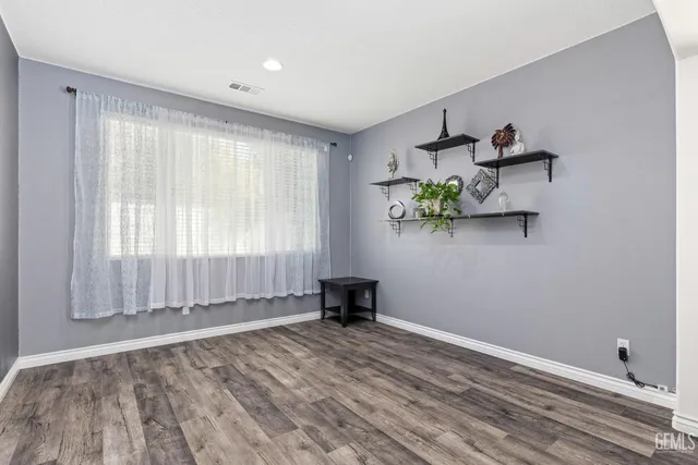 a view of room with window and hardwood floor