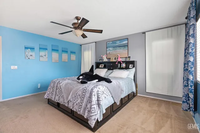 a bedroom with bed and window