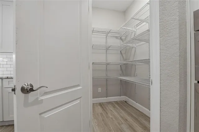 a bathroom with double vanity and a granite counter tops