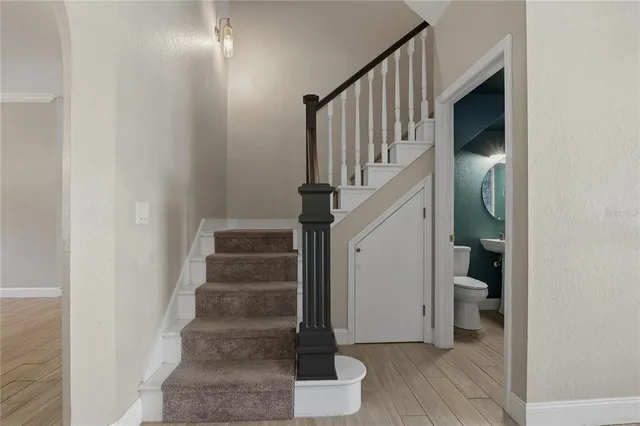 a view of a house with a ceiling fan and windows