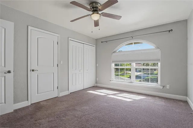 a view of a house with backyard porch and sitting area
