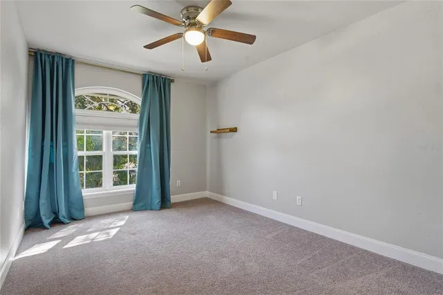 an aerial view of a house with outdoor space and lake view