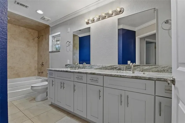 an aerial view of a house with garden space and street view