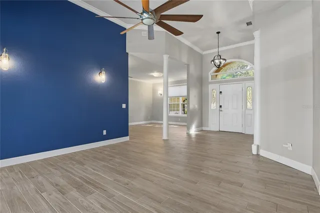 a view of a room with wooden floor and stairs