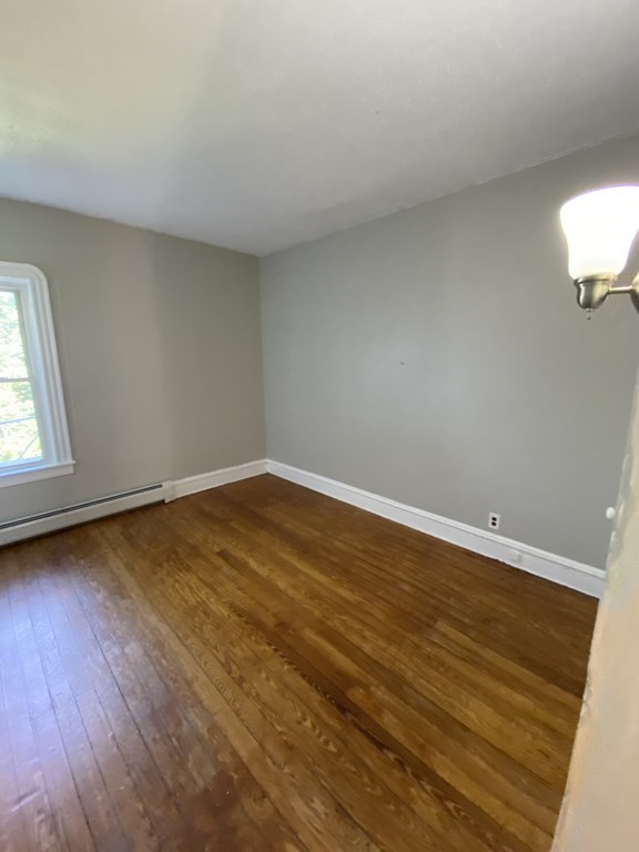 672 2nd Street Fall River, MA 02721 - Photo 6 of 16 wooden floor in an empty room