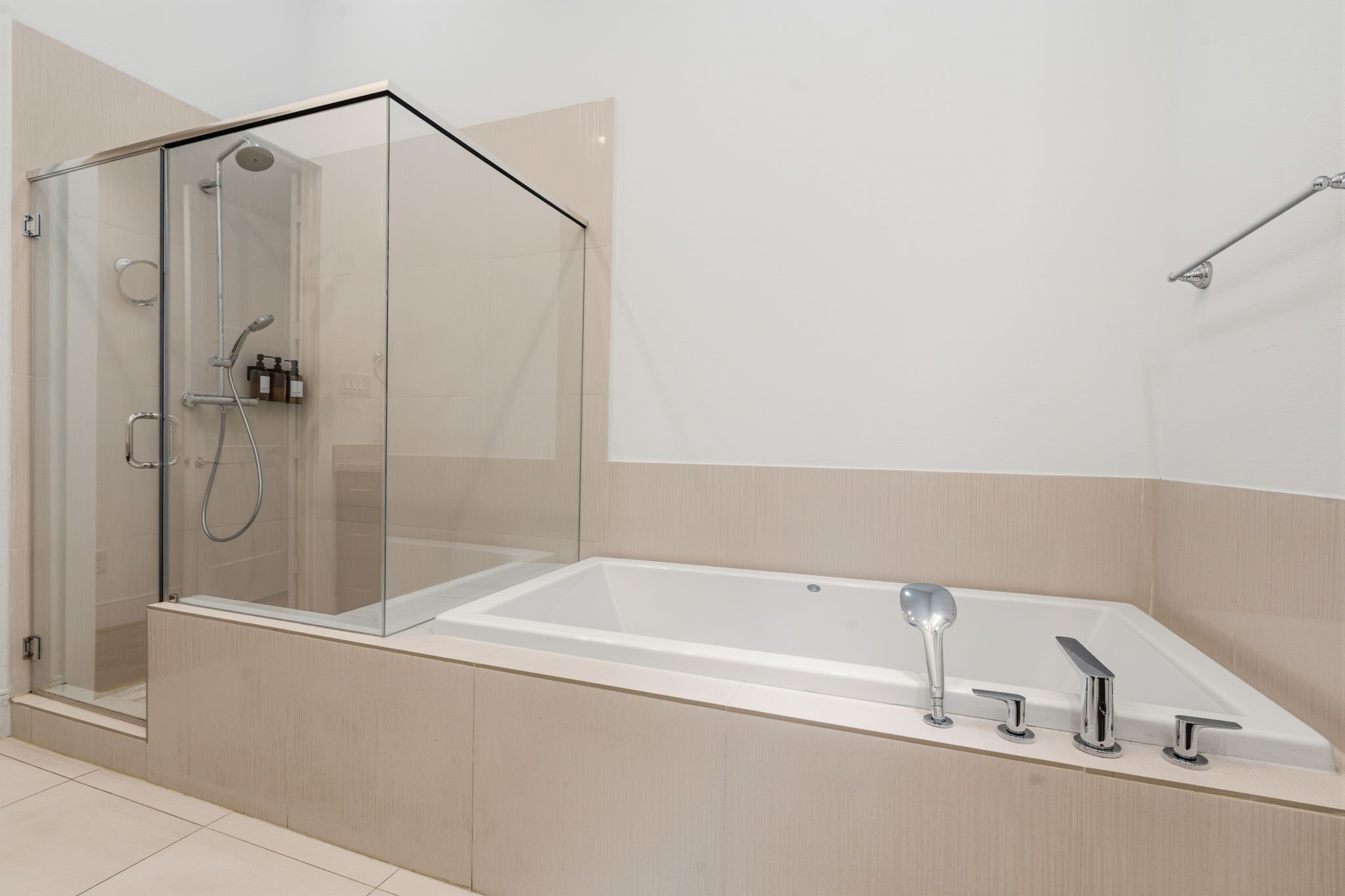 2624 Rusk Street Houston, TX 77003 - Photo 25 of 30 Luxurious primary bath featuring a sleek glass shower and a spacious soaking tub for ultimate relaxation.