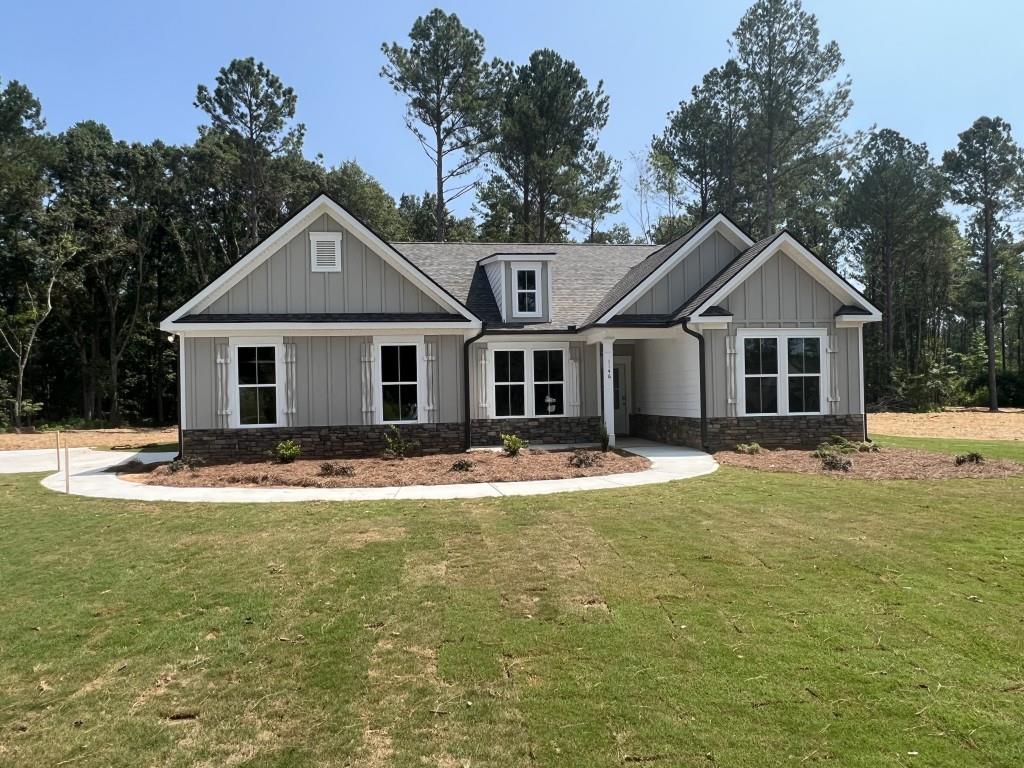 1146 Gene Bell Road Northeast Monroe, GA 30655 - Photo 1 of 1 a front view of a house with a garden and porch