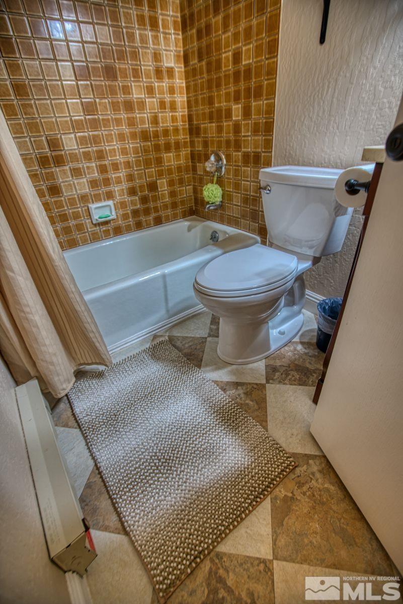 313 Tramway Drive, Unit 26 Stateline, NV 89449 - Photo 12 of 19 a bathroom with a toilet and a shower