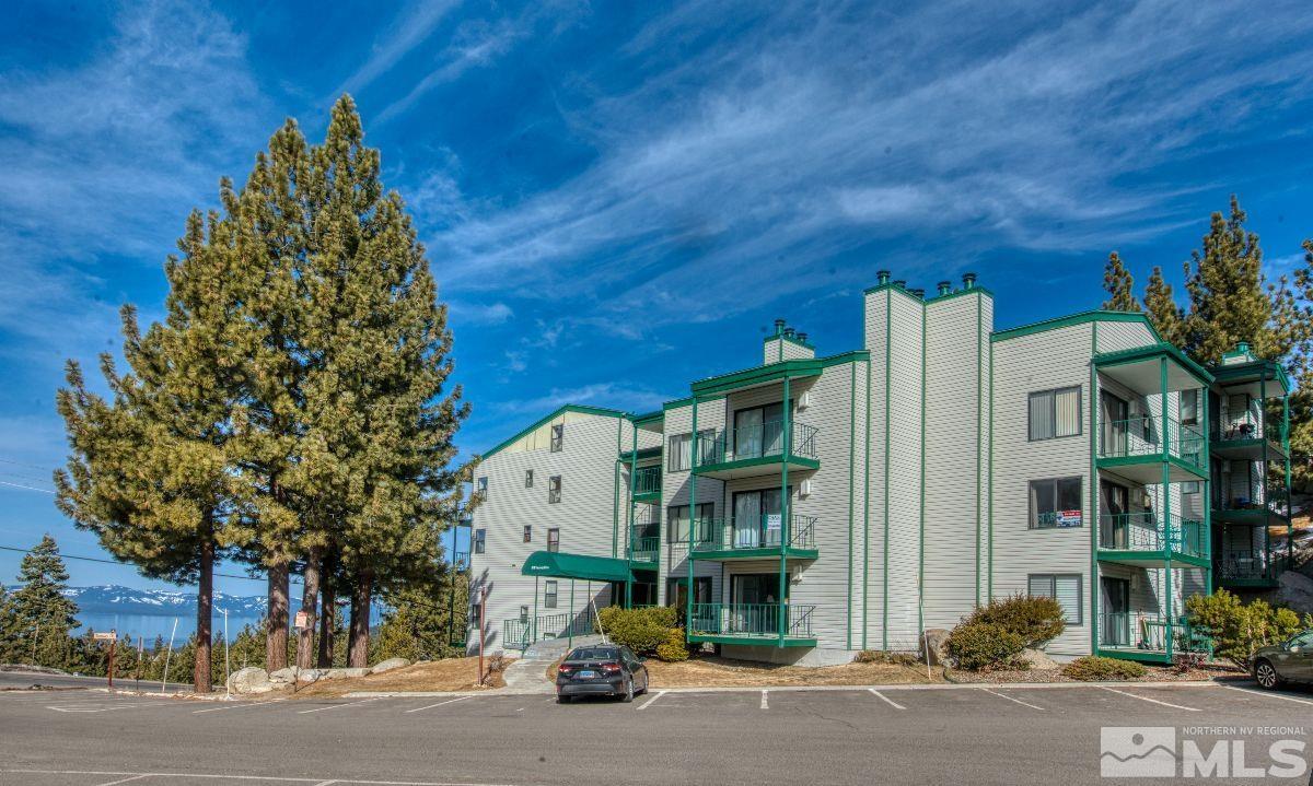 313 Tramway Drive, Unit 26 Stateline, NV 89449 - Photo 14 of 19 a man standing next to a building