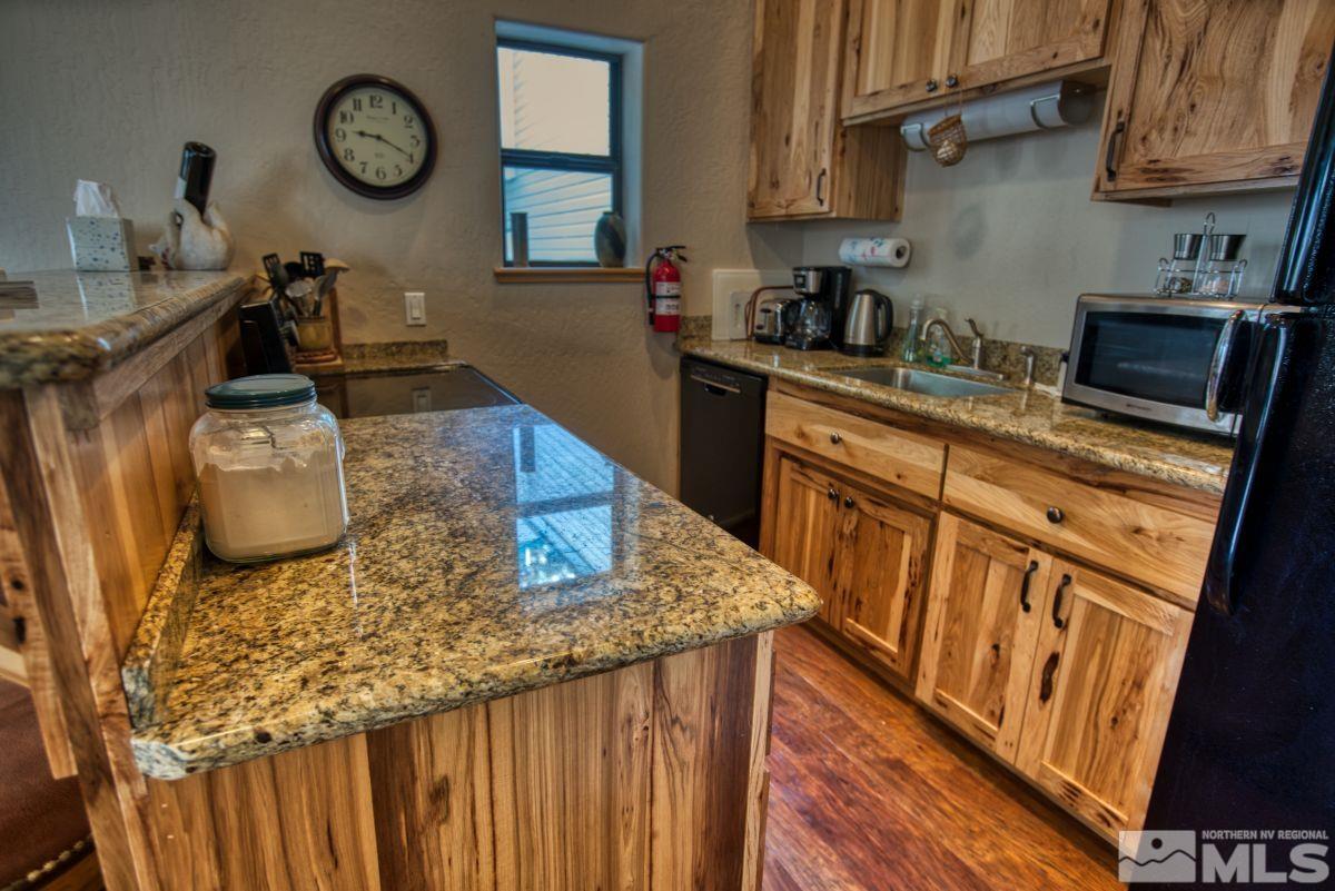 313 Tramway Drive, Unit 26 Stateline, NV 89449 - Photo 3 of 19 a kitchen with sink refrigerator and stove