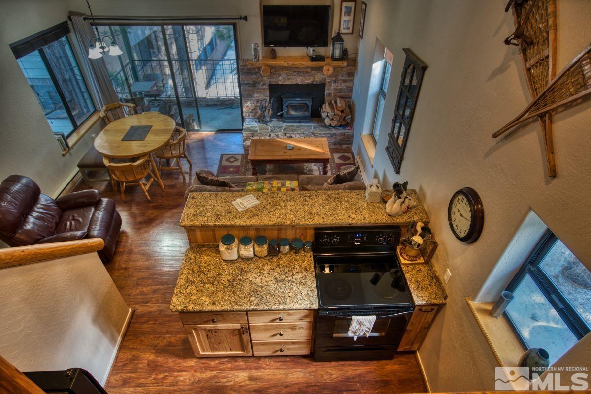 313 Tramway Drive, Unit 26 Stateline, NV 89449 - Photo 4 of 19 a living room with furniture and a fireplace