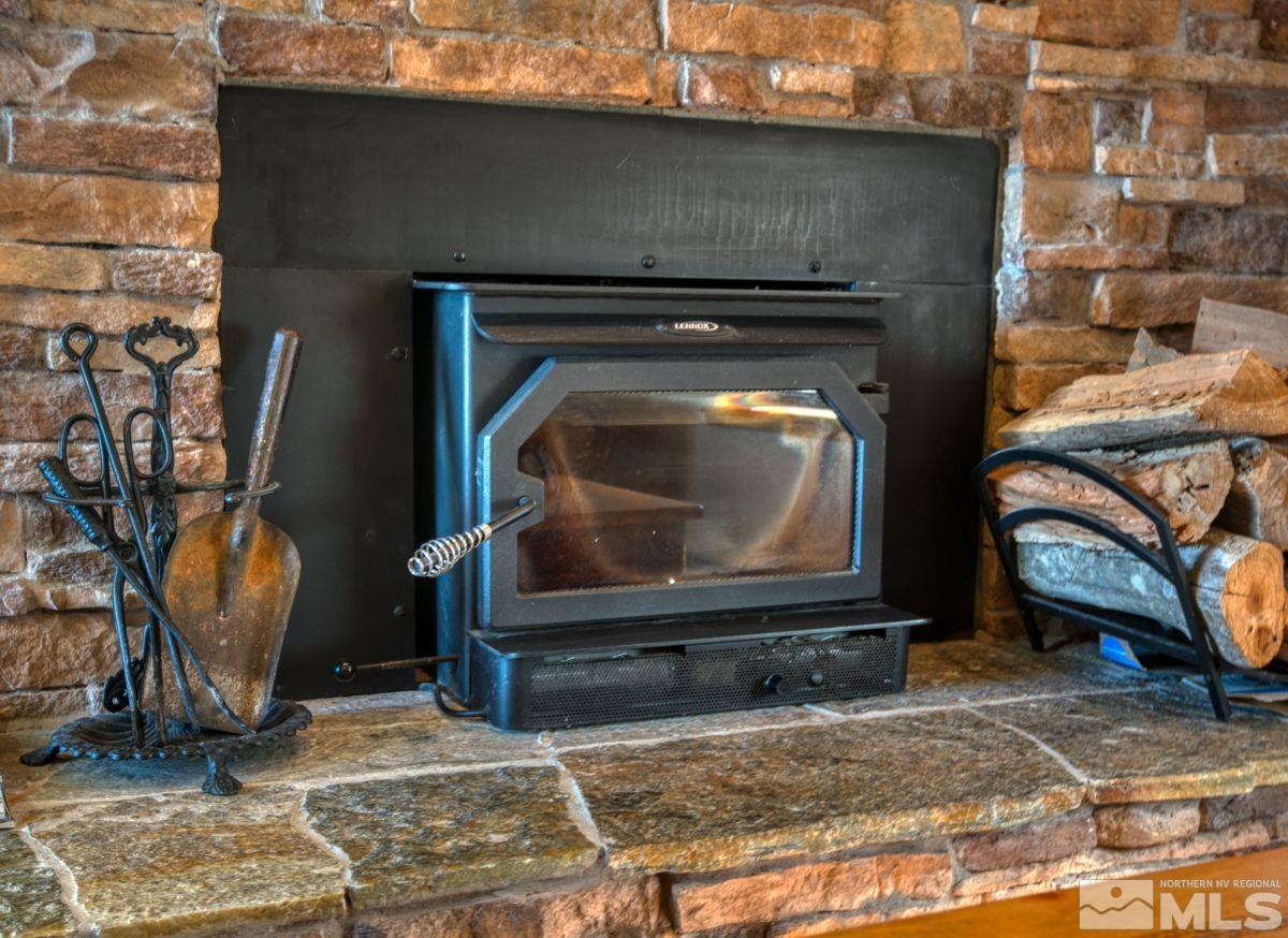 313 Tramway Drive, Unit 26 Stateline, NV 89449 - Photo 5 of 19 a living room with a fireplace and a rug