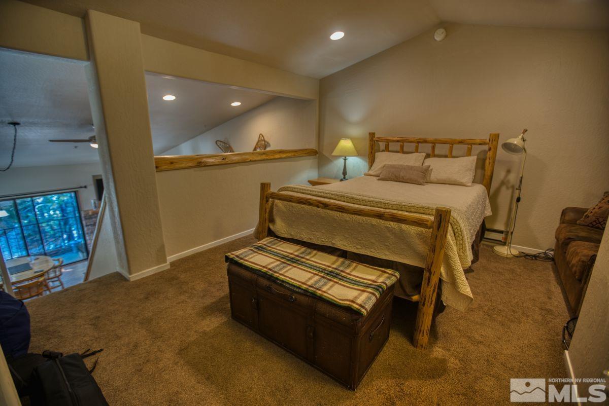 313 Tramway Drive, Unit 26 Stateline, NV 89449 - Photo 9 of 19 a bed room with furniture and window