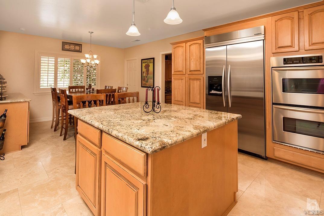 4113 Eve Road Simi Valley, CA 93063 - Photo 14 of 31 a kitchen with stainless steel appliances granite countertop a sink refrigerator and cabinets