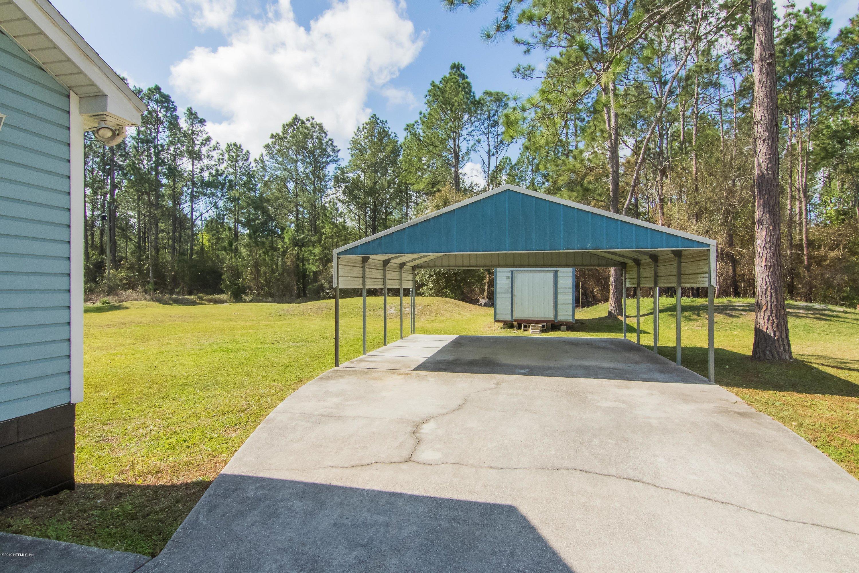 6345 Armstrong Road Elkton, FL 32033 - Photo 5 of 26 a house with swimming pool in front of it