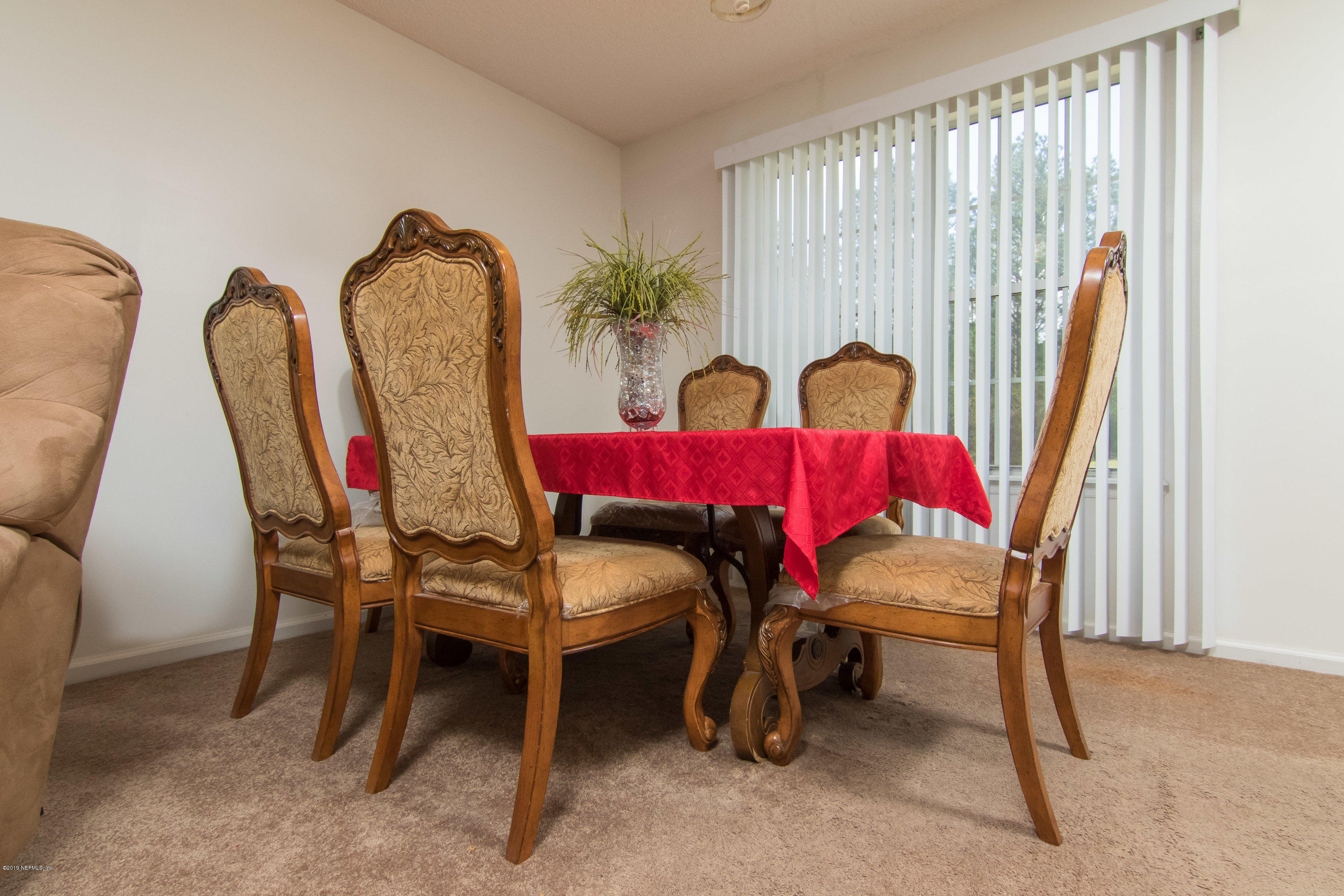 6345 Armstrong Road Elkton, FL 32033 - Photo 10 of 26 a dining room with furniture and wooden floor
