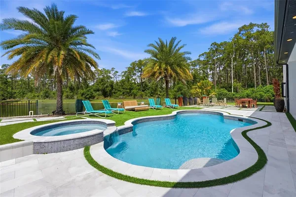 a view of a swimming pool with a patio