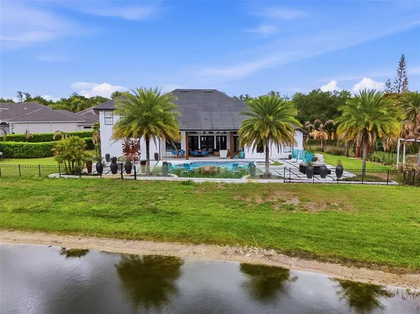 a view of a swimming pool and a yard