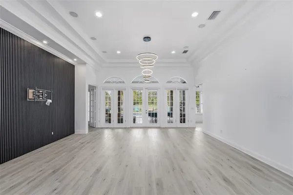 a view of a room with wooden floor