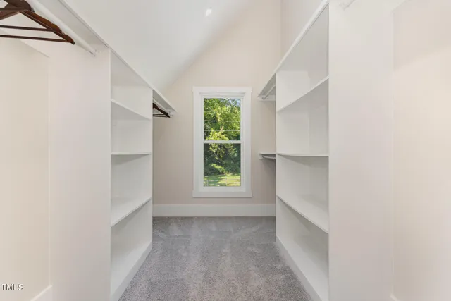 a bathroom with a shower sink and mirror