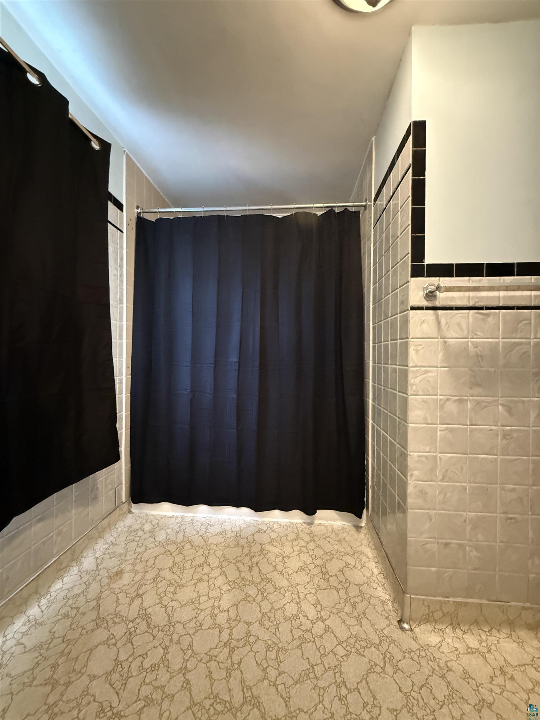 3001 3rd Avenue West Hibbing, MN 55746 - Photo 23 of 38 Bathroom with tile walls