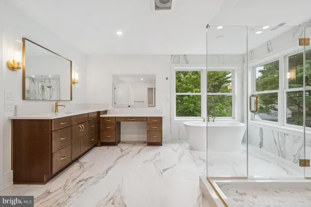 a bathroom with a bathtub and shower
