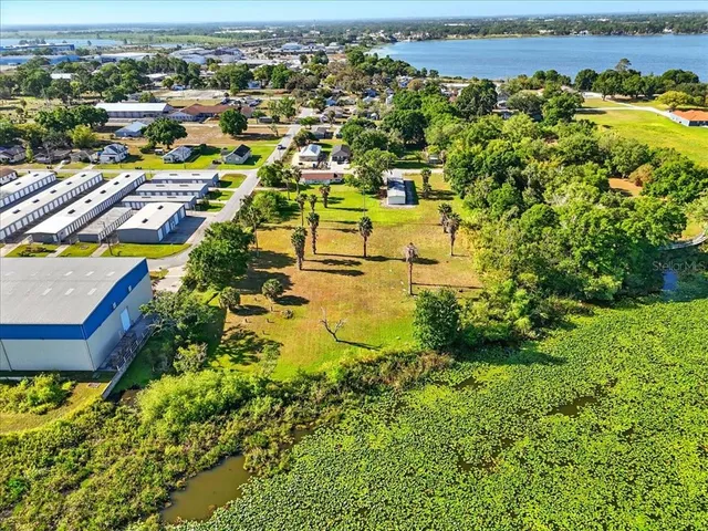 an aerial view of a residential building with an ocean view