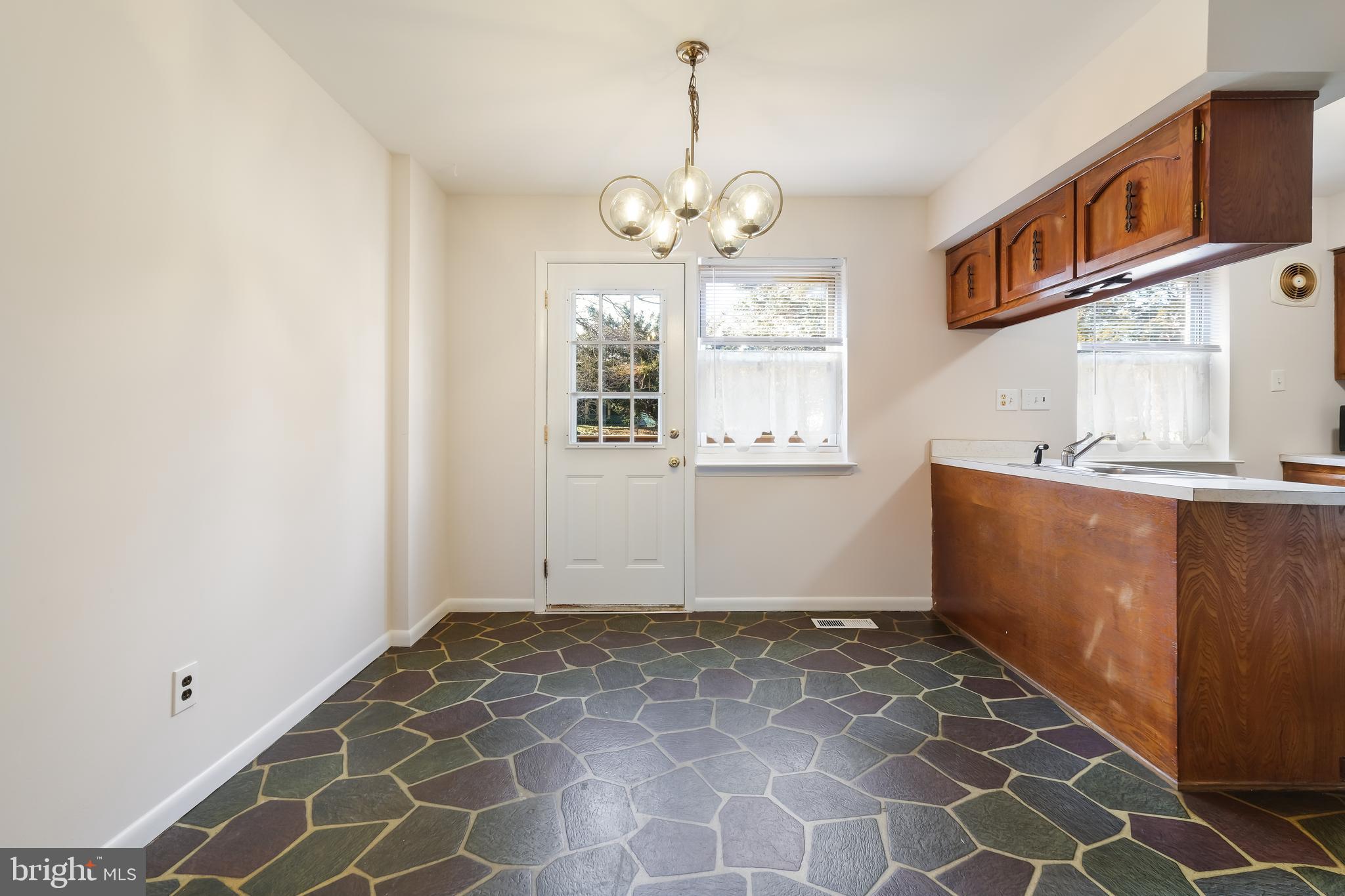 829 West Bells Mill Road Philadelphia, PA 19128 - Photo 11 of 33 Spacious eat in kitchen, access to outside deck
