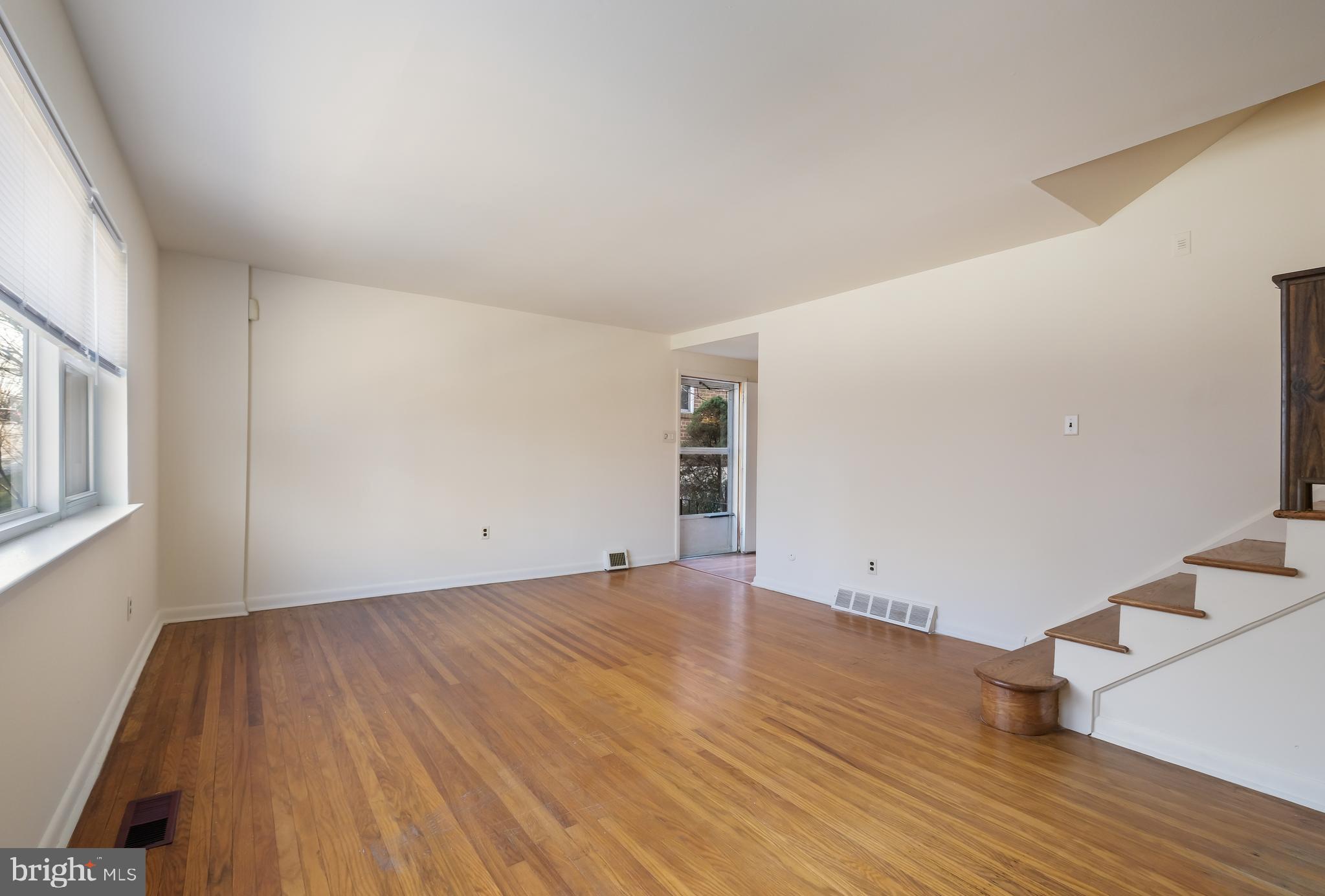 829 West Bells Mill Road Philadelphia, PA 19128 - Photo 5 of 33 Large living room with hardwood floors