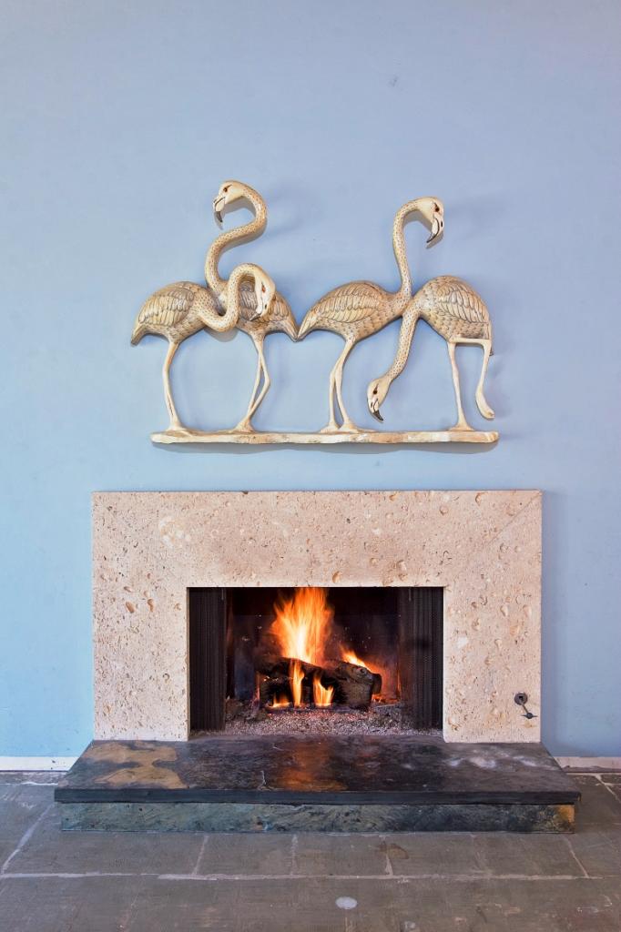 2296 Las Tunas Road Santa Barbara, CA 93103 - Photo 4 of 13 a fireplace with a clock on the wall
