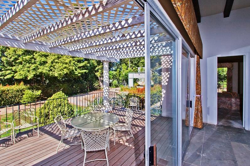 2296 Las Tunas Road Santa Barbara, CA 93103 - Photo 9 of 13 a view of a chairs and table in patio with wooden fence