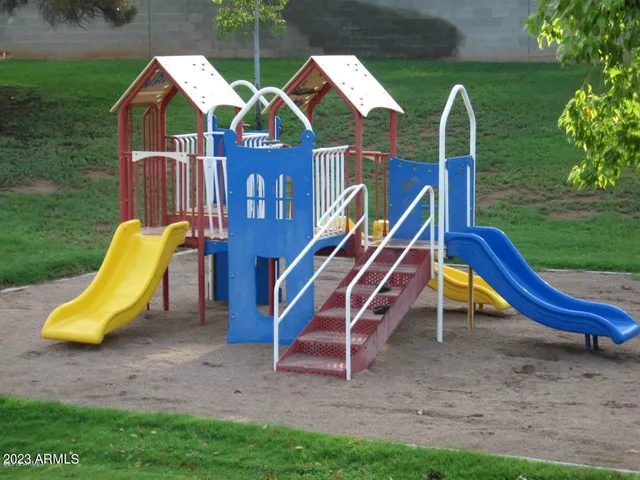 a view of a yard with a slide
