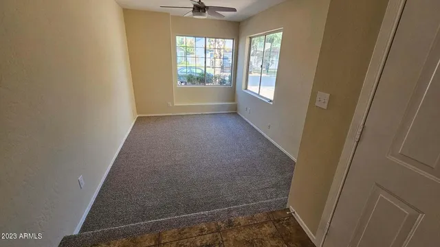 a view of hallway with windows